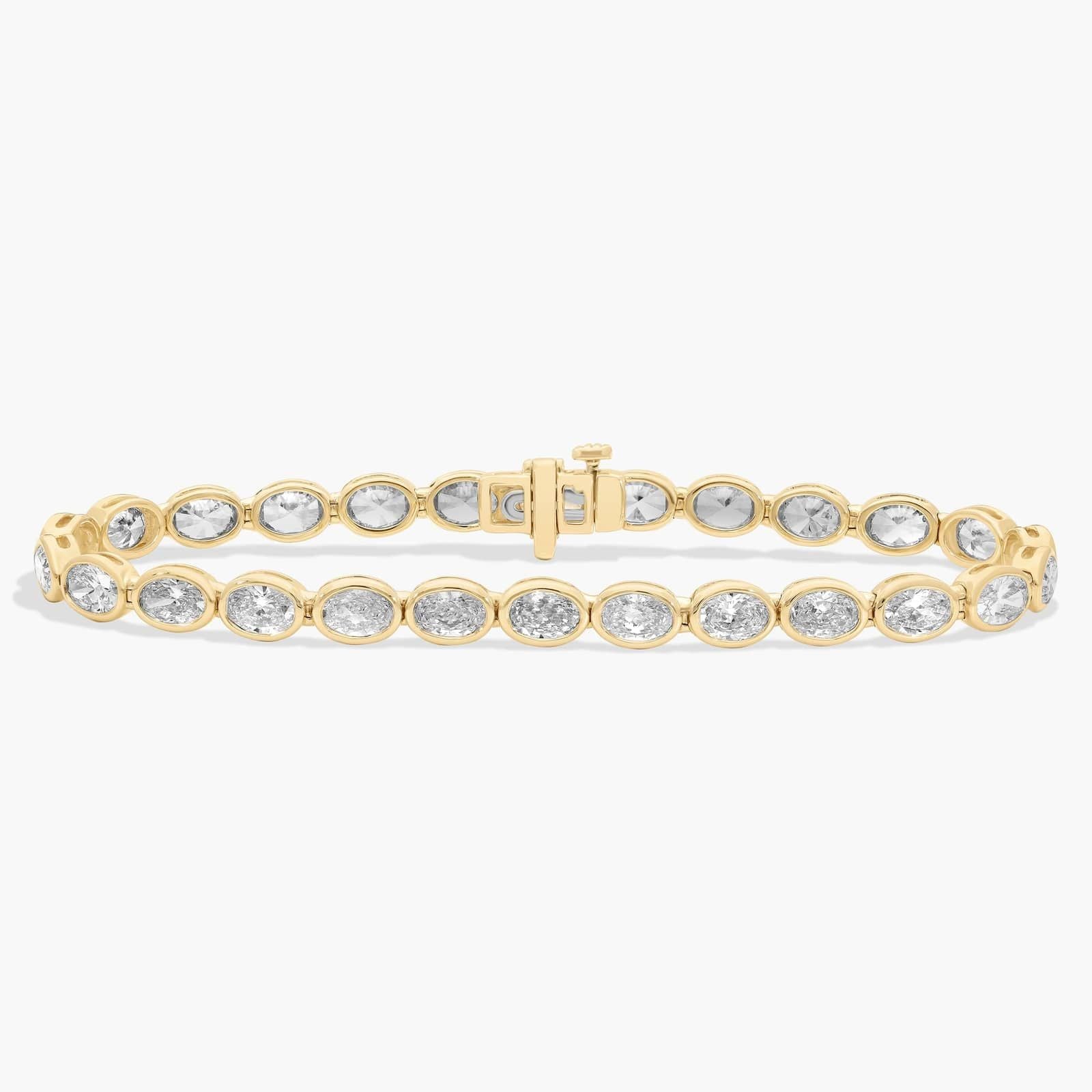 7 " Oval Cut Diamond E/W Bezel Set Tennis Bracelet In 14K Yellow Gold (10 Ct. tw. - H-I / SI1-SI2)